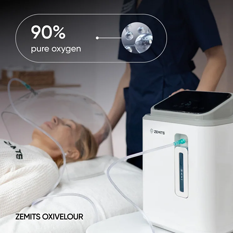 Oxygen infusion facial setup featuring a Zemits machine delivering 90% pure oxygen to a client through a transparent dome during a spa treatment.